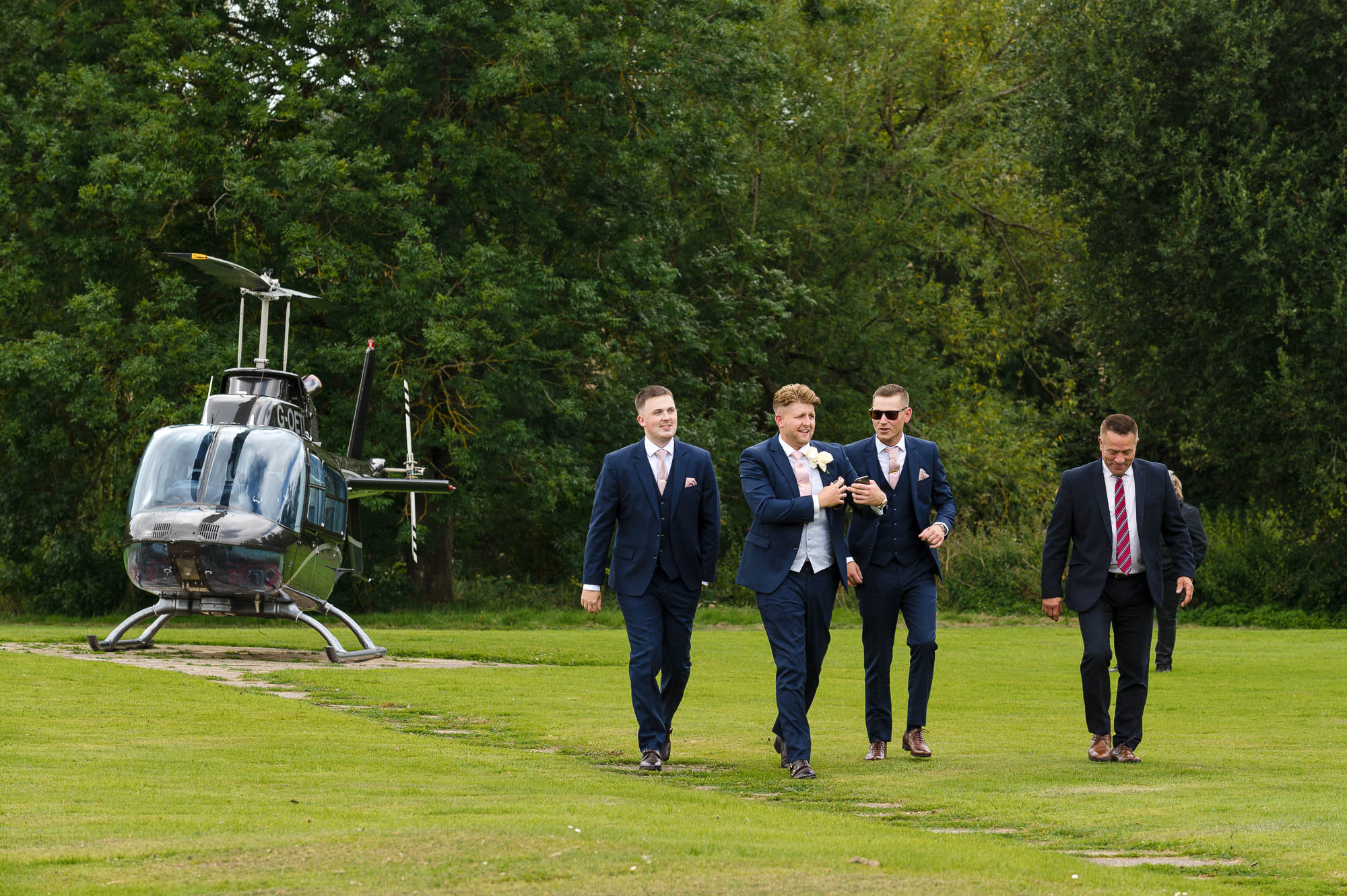 Groom arriving by helicopter at the Mercure Maidstone Great Danes Hotel wedding