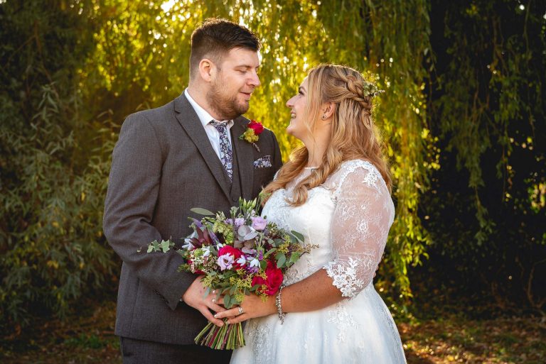 Bride and groom portrait at The Creek, Faversham following their wedding at Shepherd Neame Brewery in Faversham, Kent
