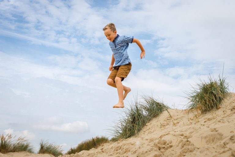 Camber Sands photo shoot, Sussex - son jumping from the sand dunes