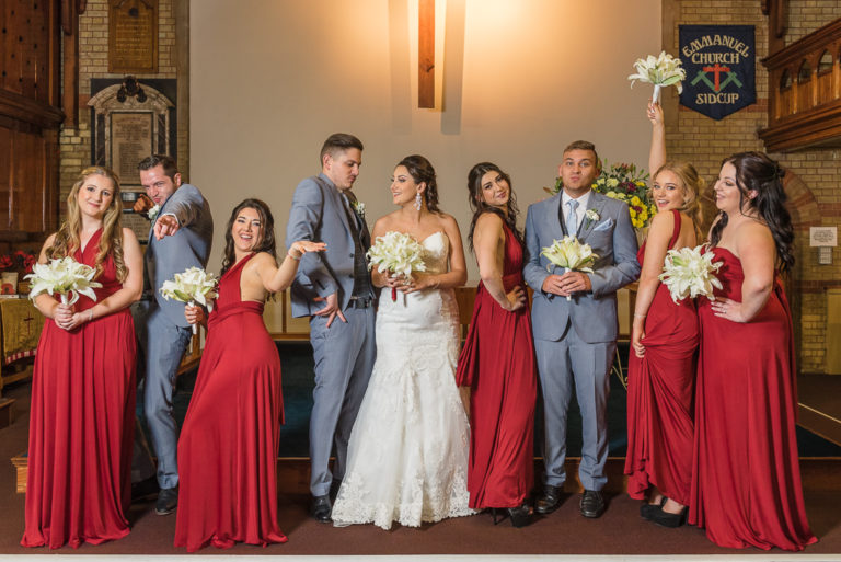 Fun group shot of the bride, groom, bridesmaids and ushers | Sidcup Wedding of Becky & Hugo | Oakhouse Photography
