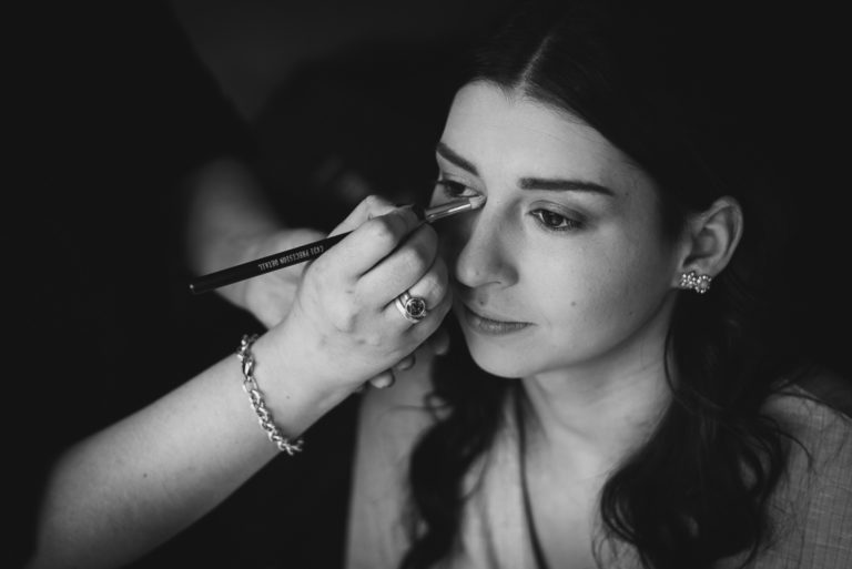 MUA with bridesmaid applying make-up during bridal prep | Sidcup Wedding of Becky & Hugo | Oakhouse Photography