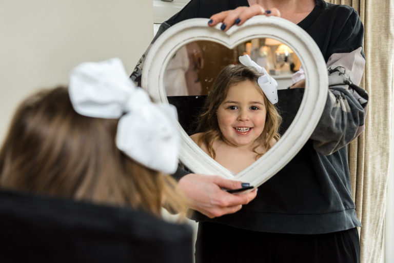 Flowergirl getting ready during bridal prep | Sidcup Wedding of Becky & Hugo | Oakhouse Photography