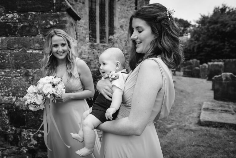 Bridesmaids and wedding party arriving at Wadhurst Church, Wadhurst, East Sussex | Oakhouse Photography
