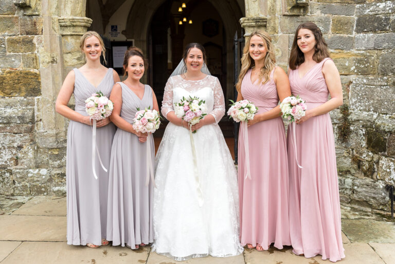 Bride and bridesmaid group photo at Wadhurst Church, Wadhurst, East Sussex | Oakhouse Photography