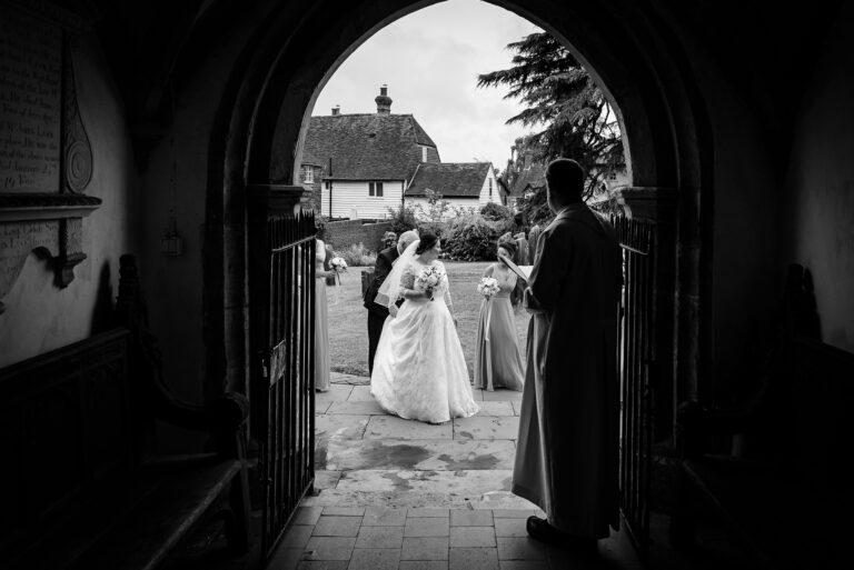 Bride and bridesmaids entering Wadhurst Church, Wadhurst, East Sussex | Oakhouse Photography