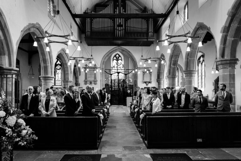 Wedding party awaiting bride’s entrance at Wadhurst Church, Wadhurst, East Sussex | Oakhouse Photography