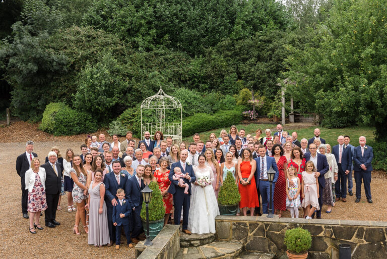 Wedding party group photograph at Swallows Oast wedding venue, Ticehurst, East Sussex | Oakhouse Photography