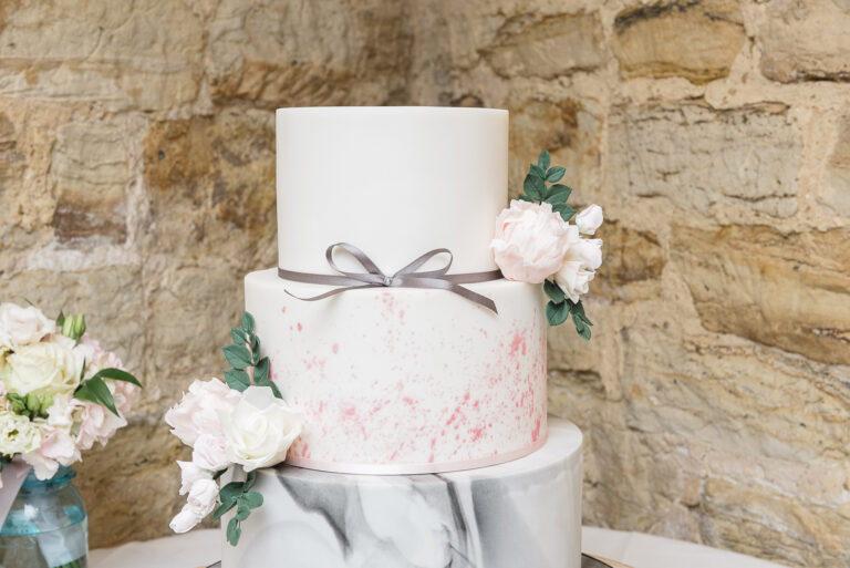 Wedding cake on display at Swallows Oast wedding venue, Ticehurst, East Sussex | Oakhouse Photography