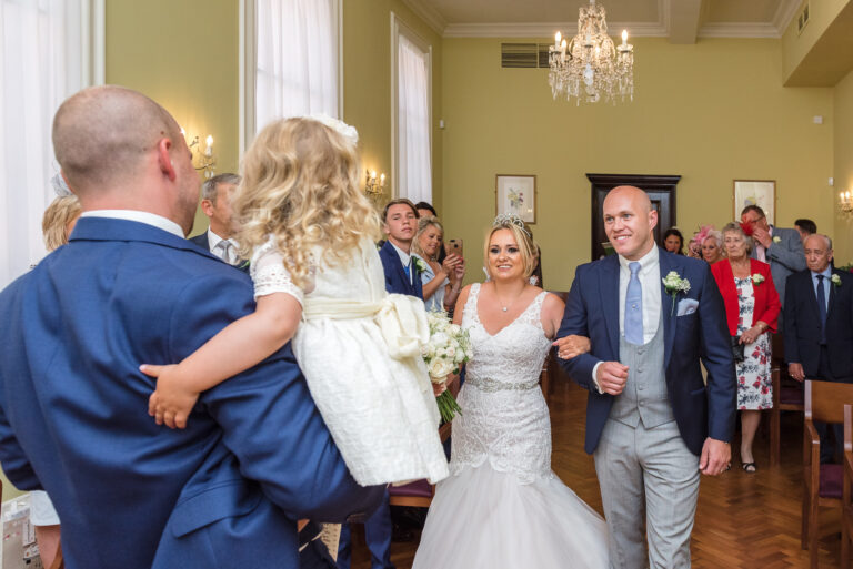Groom and bride see each other in the wedding ceremony room at Chelsea Old Town Hall, King’s Road, London | Oakhouse Photography