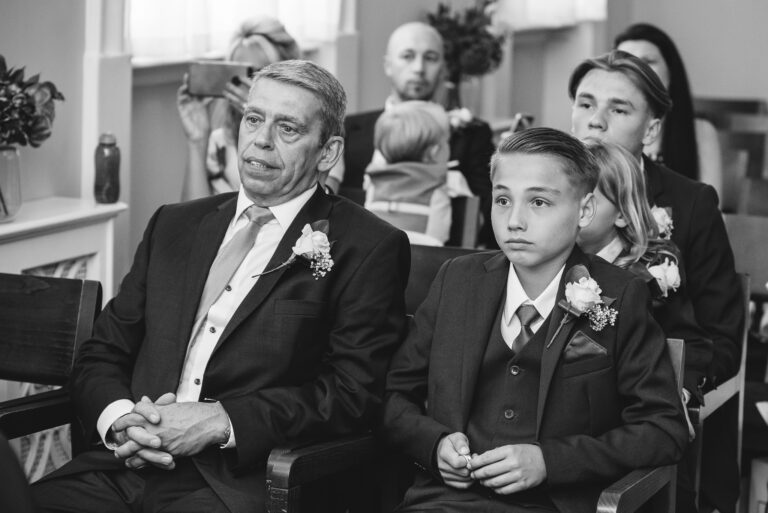 Groom's son and father during the wedding ceremony at Chelsea Old Town Hall, King’s Road, London | Oakhouse Photography