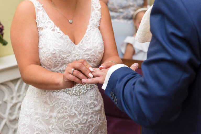 Exchanging of the wedding rings at Chelsea Old Town Hall, King’s Road, London | Oakhouse Photography