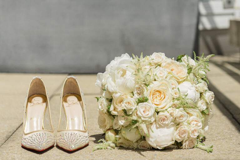 Wedding flowers and wedding shoes photographed on the balcony of the penthouse at the Chelsea Harbour Hotel, Chelsea, London