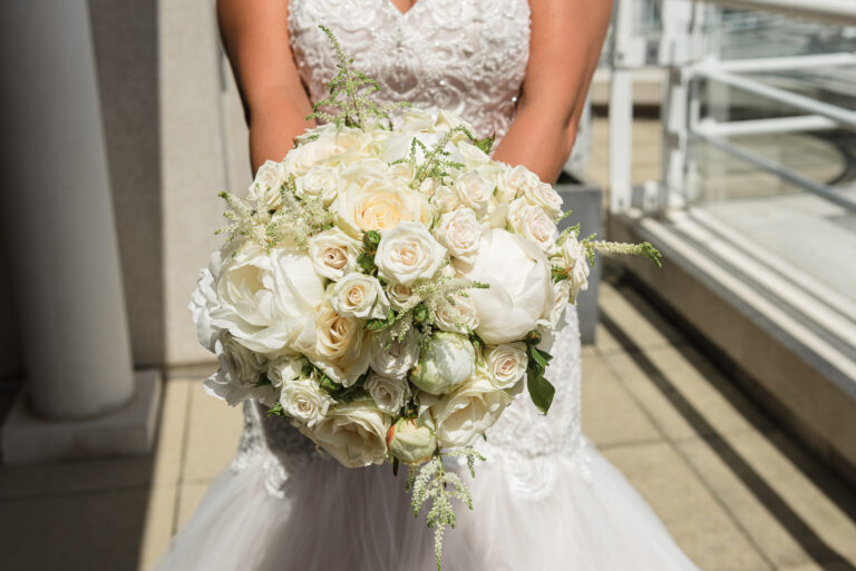 Bride holding wedding flower bouquet at the Chelsea Harbour Hotel, Chelsea, London