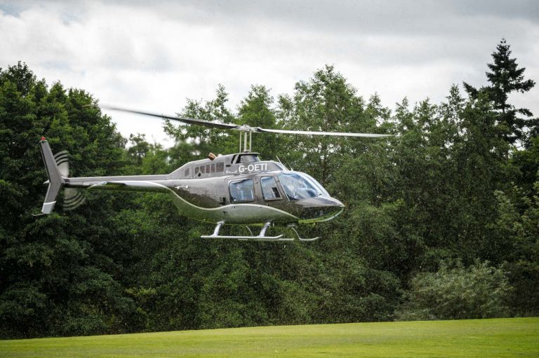 Groom arriving by helicopter at the Mercure Maidstone Great Danes Hotel wedding