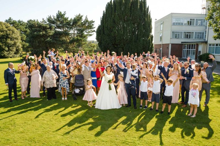 Family and friends group photograph at the Mercure Maidstone Great Danes Hotel wedding