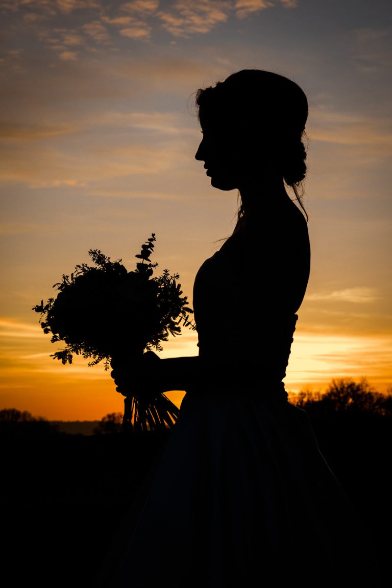 Silhouette of winter bride at Swallows Oast wedding venue, Ticehurst, East Sussex