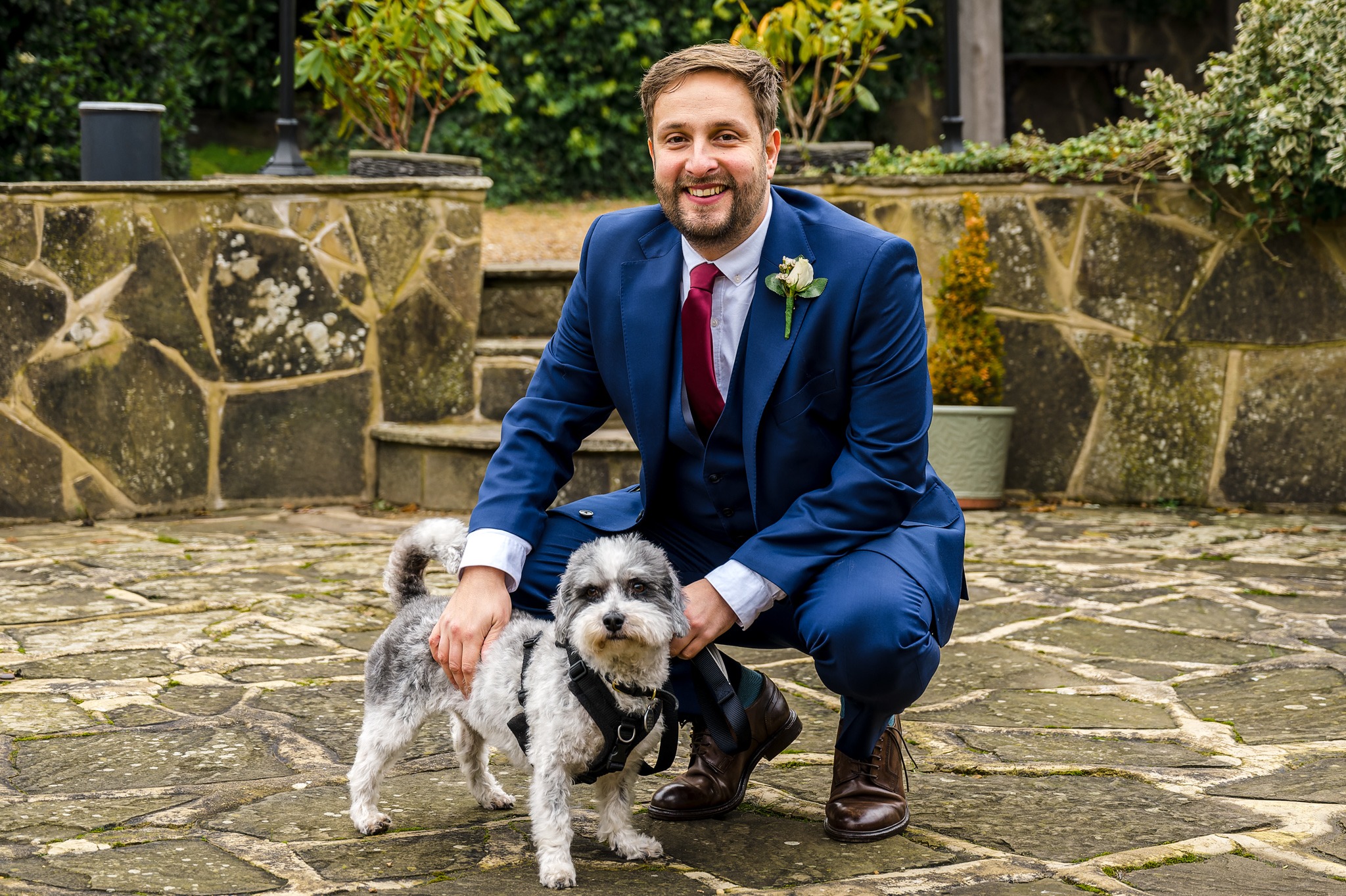 Usher with the bride and groom's pet dog and ring bearer | Oakhouse Photography