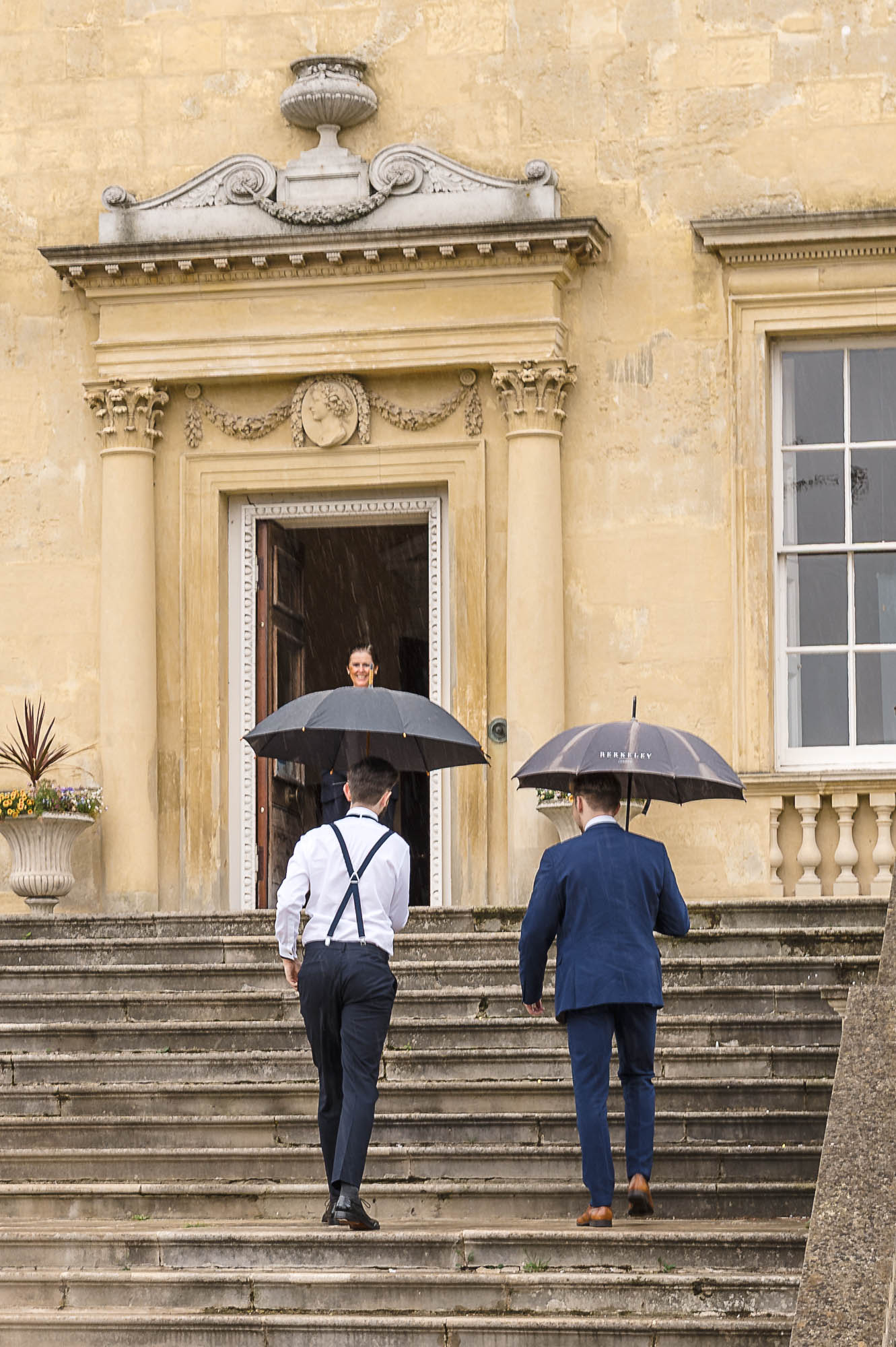 Groom and best man walking up the steps to Danson House, Danson Park, Bexleyheath, Kent