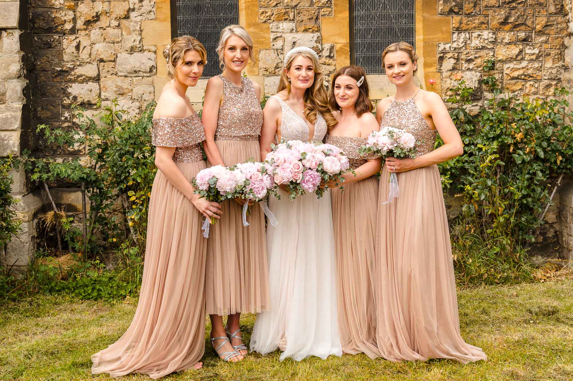 Bride and bridesmaids in the grounds of St John the Baptist Church in Eltham, London
