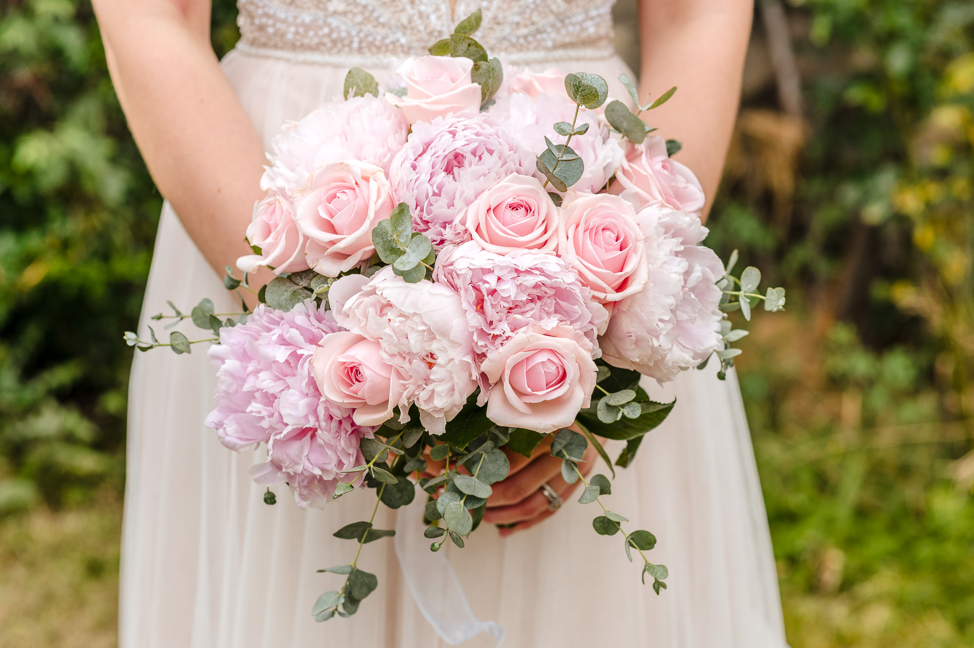Bridal bouquet consisting of pink roses and peonies at a London wedding
