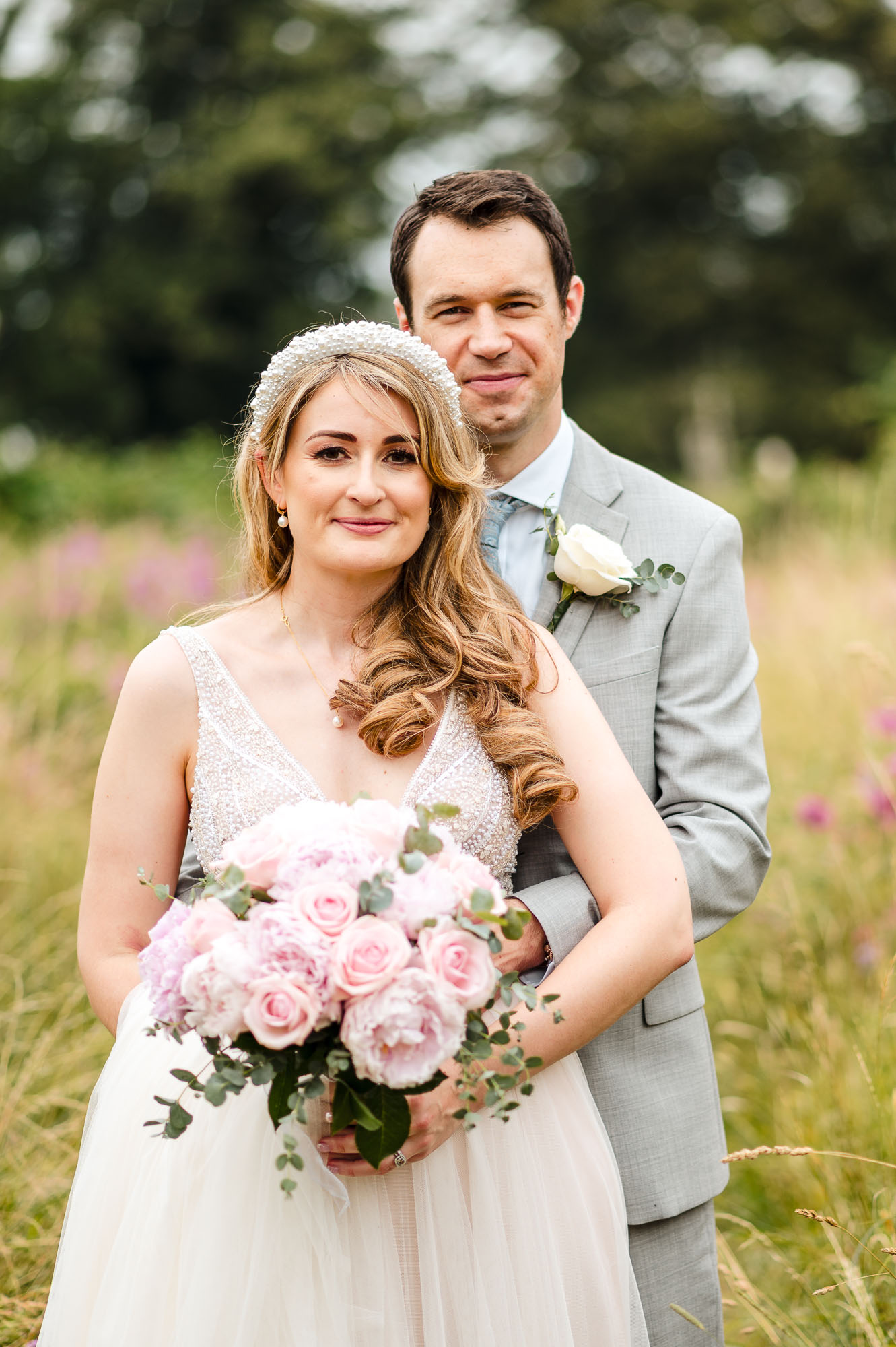 Portrait of the bride and groom in the grounds of St John the Baptist Church in Eltham, London