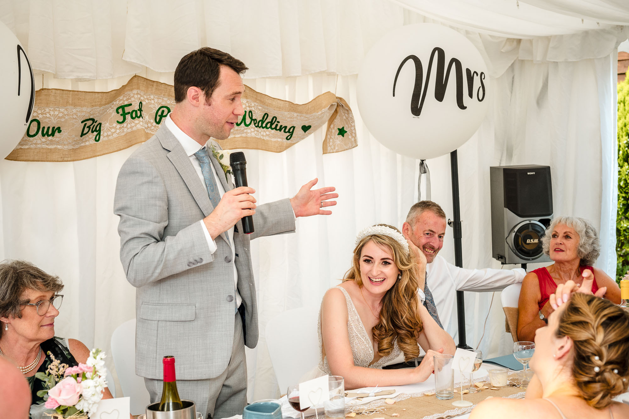 Documentary photograph of the groom reading his wedding speech at a Eltham, London wedding