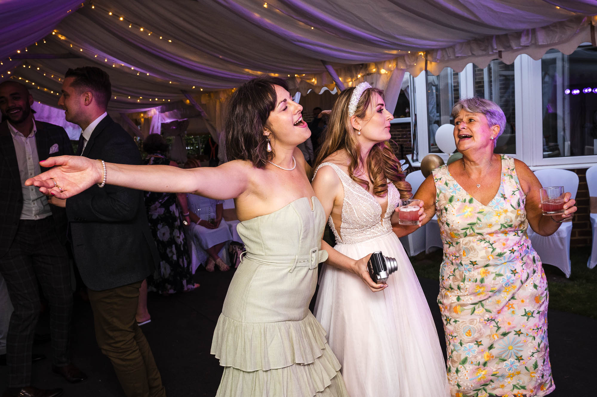 Evening party dancing at a marquee wedding reception in Eltham, London