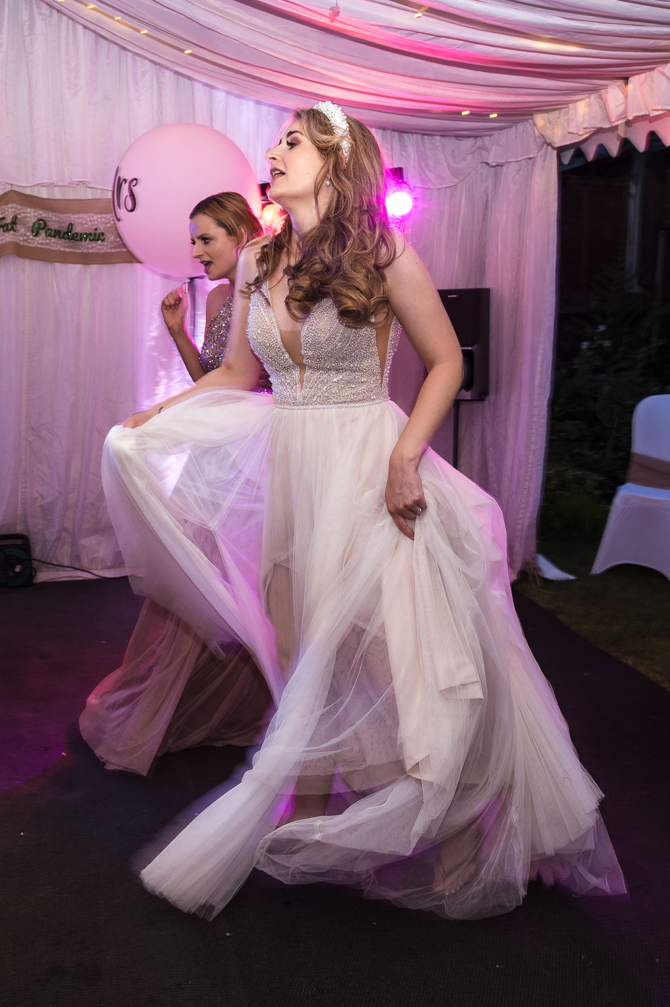 Bride dancing at a marquee wedding reception in Eltham, London