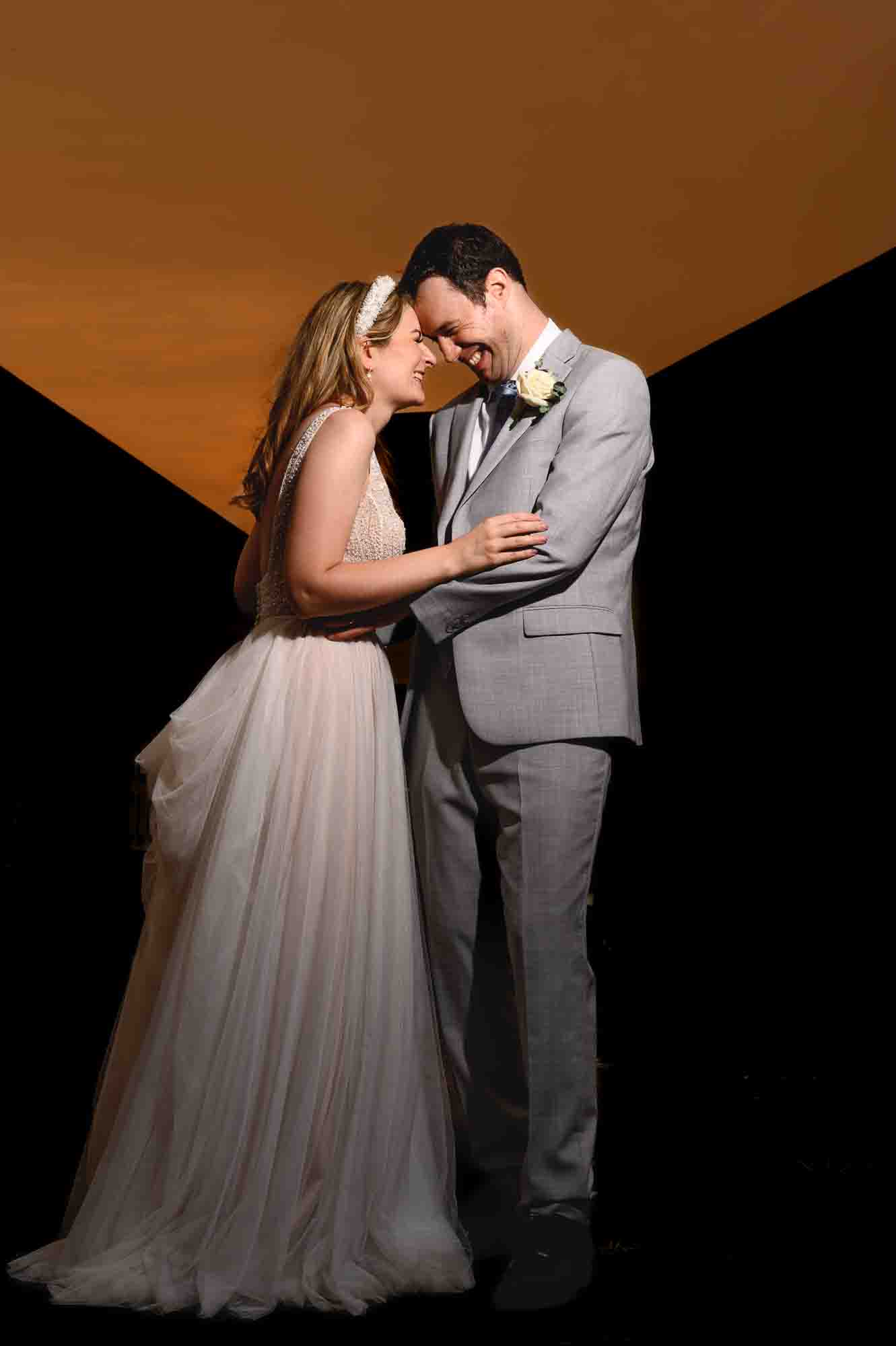 Bride and groom sunset portrait using creative off-camera flash in Eltham, London