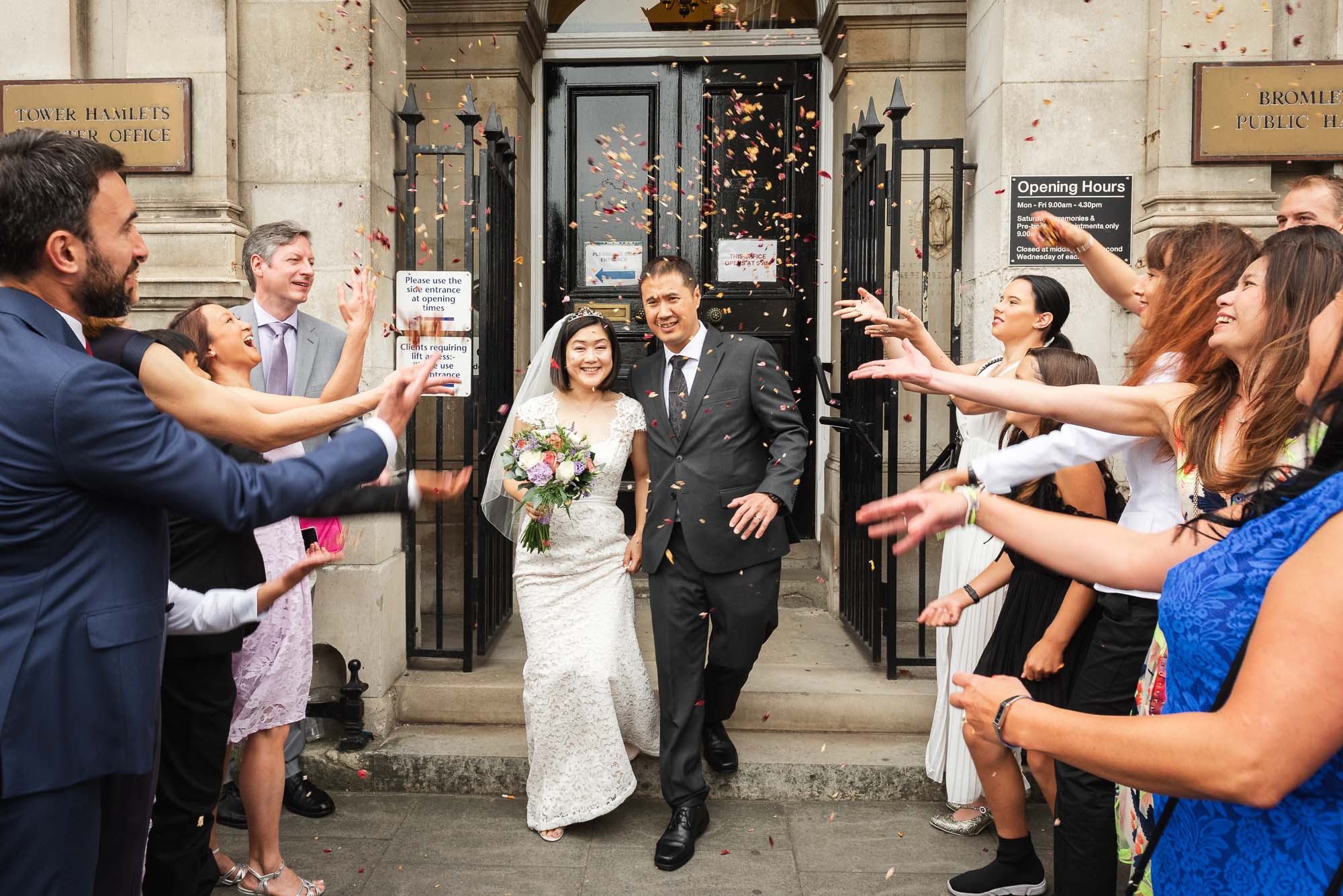 Bride and groom leaving Bromley Town Hall after their civil ceremony in London