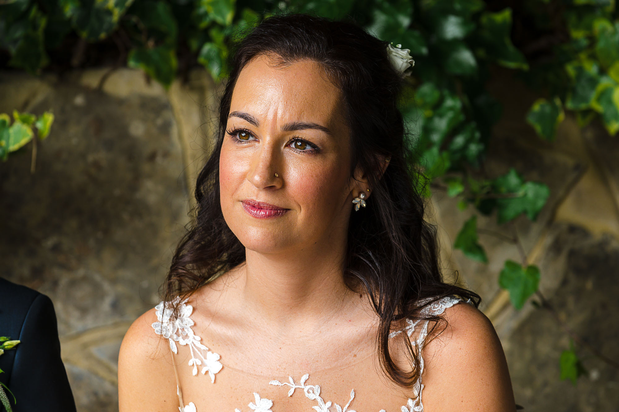 Candid image of bride under The Pavilion at Swallows Oast wedding venue in Ticehurst, East Sussex