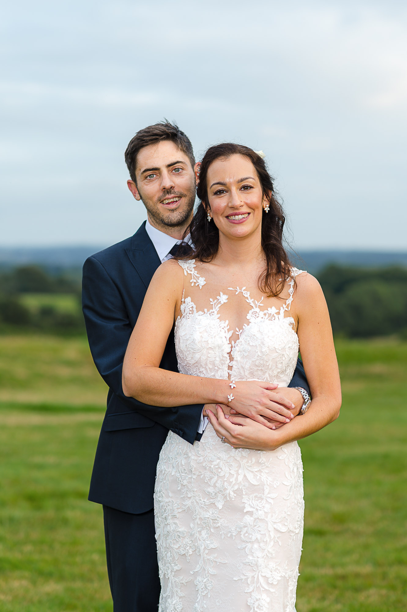 Portrait of bride and groom in Swallows Oast wedding venue's meadow