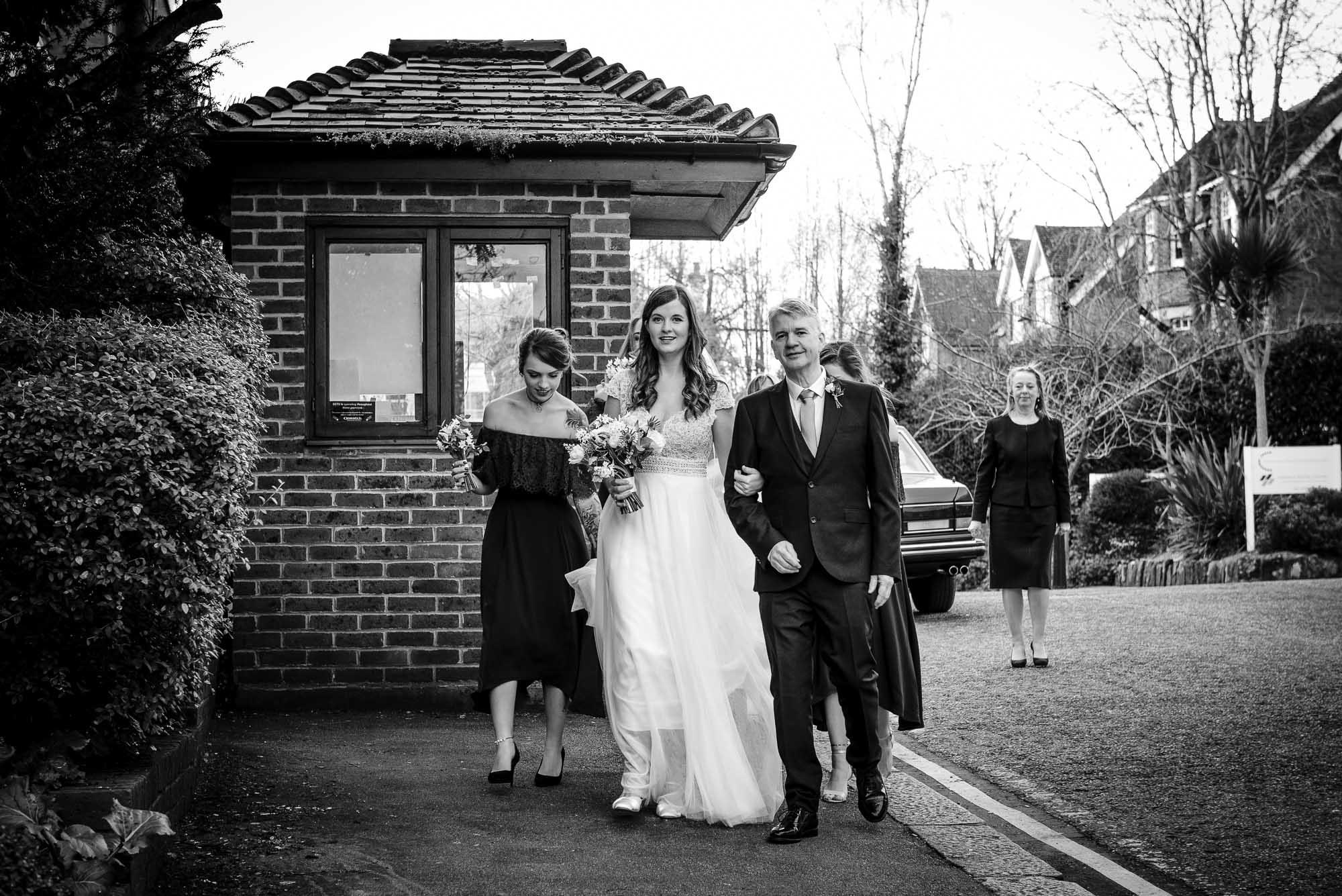 Bride arriving with her father and bridesmaids to The Barn Pub & Restaurant wedding in Tunbridge
