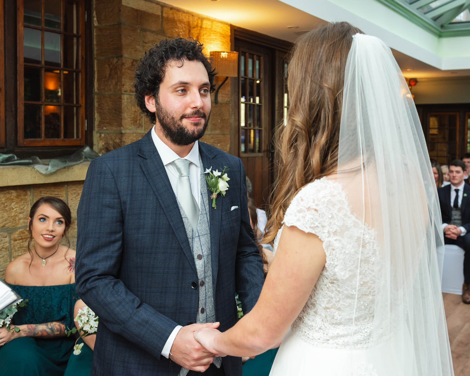 Wedding ceremony with the bride and groom exchange vows at The Barn Pub & Restaurant wedding in Tunbridge Wells, Kent