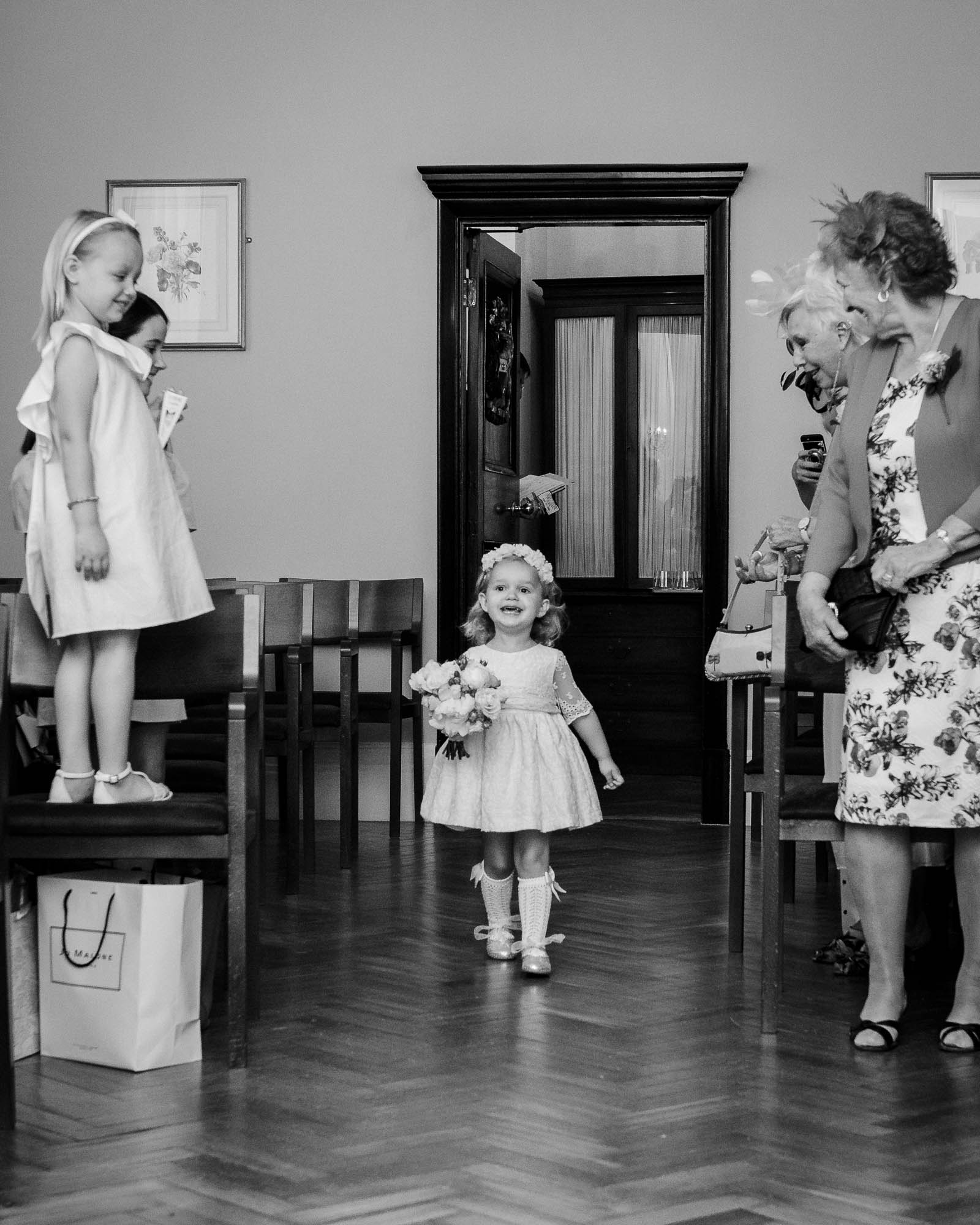 Flowergirl entering the ceremony room at Chelsea Old Town Hall wedding