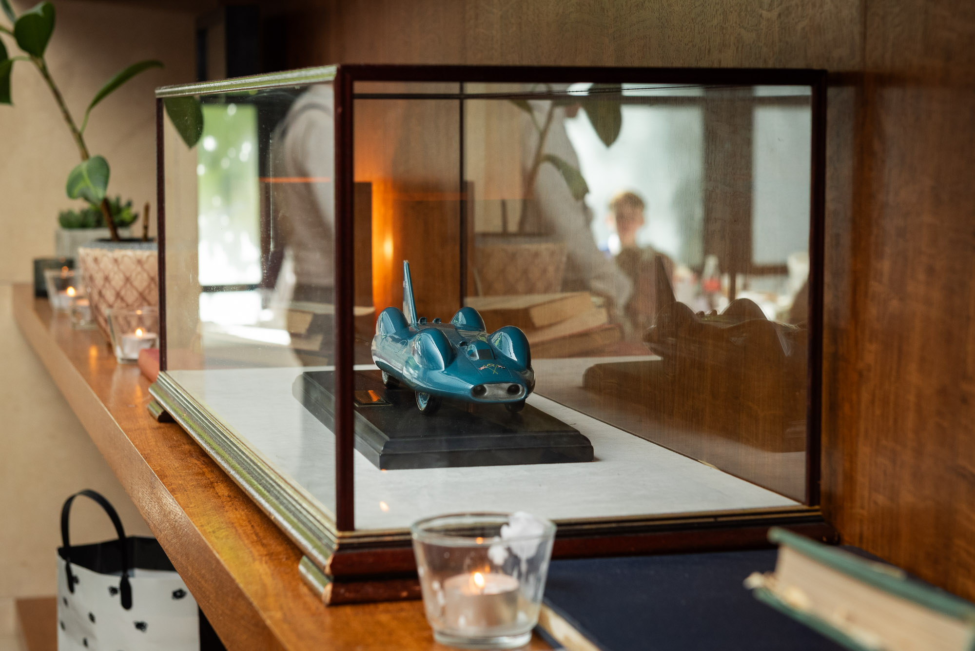 Model of Bluebird classic car in display case at Bluebird Chelsea