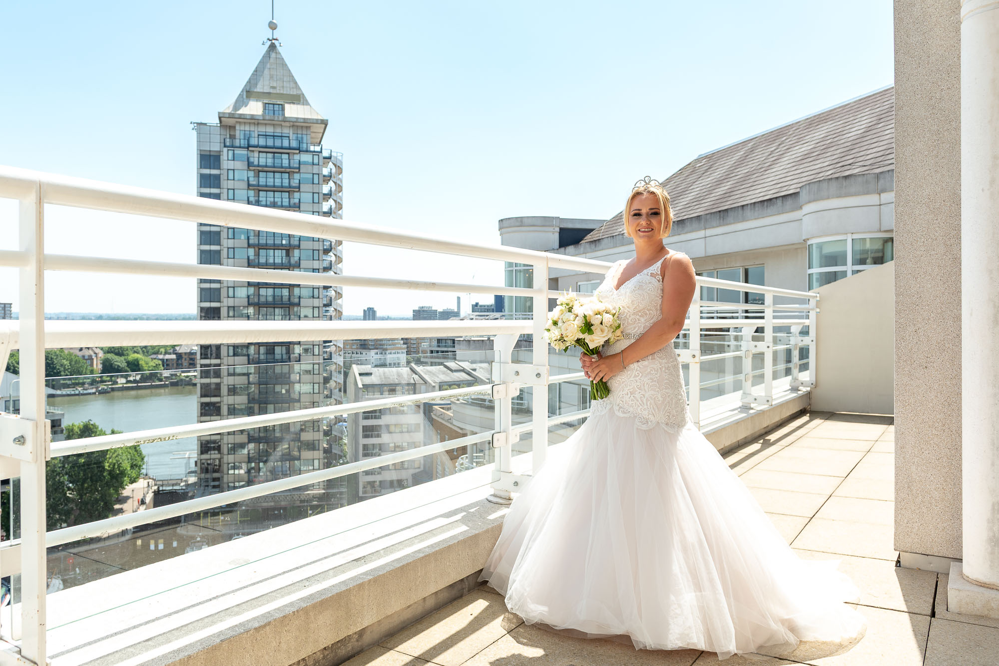Portrait of bride on balcony at Chelsea Harbour Hotel, London