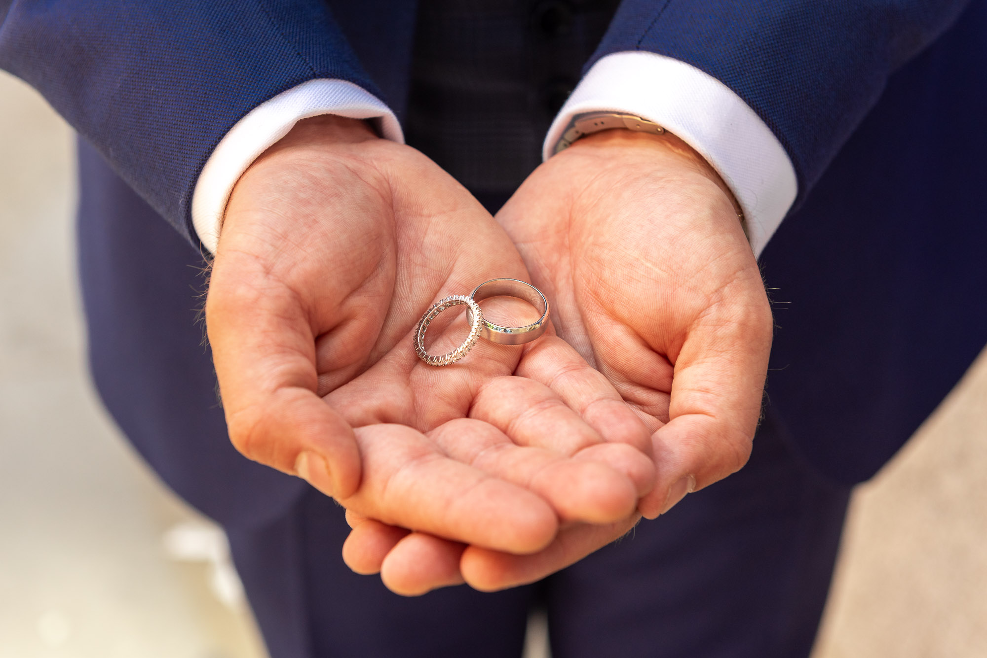 Groom showing off the wedding rings at his Chelsea Old Town Hall wedding