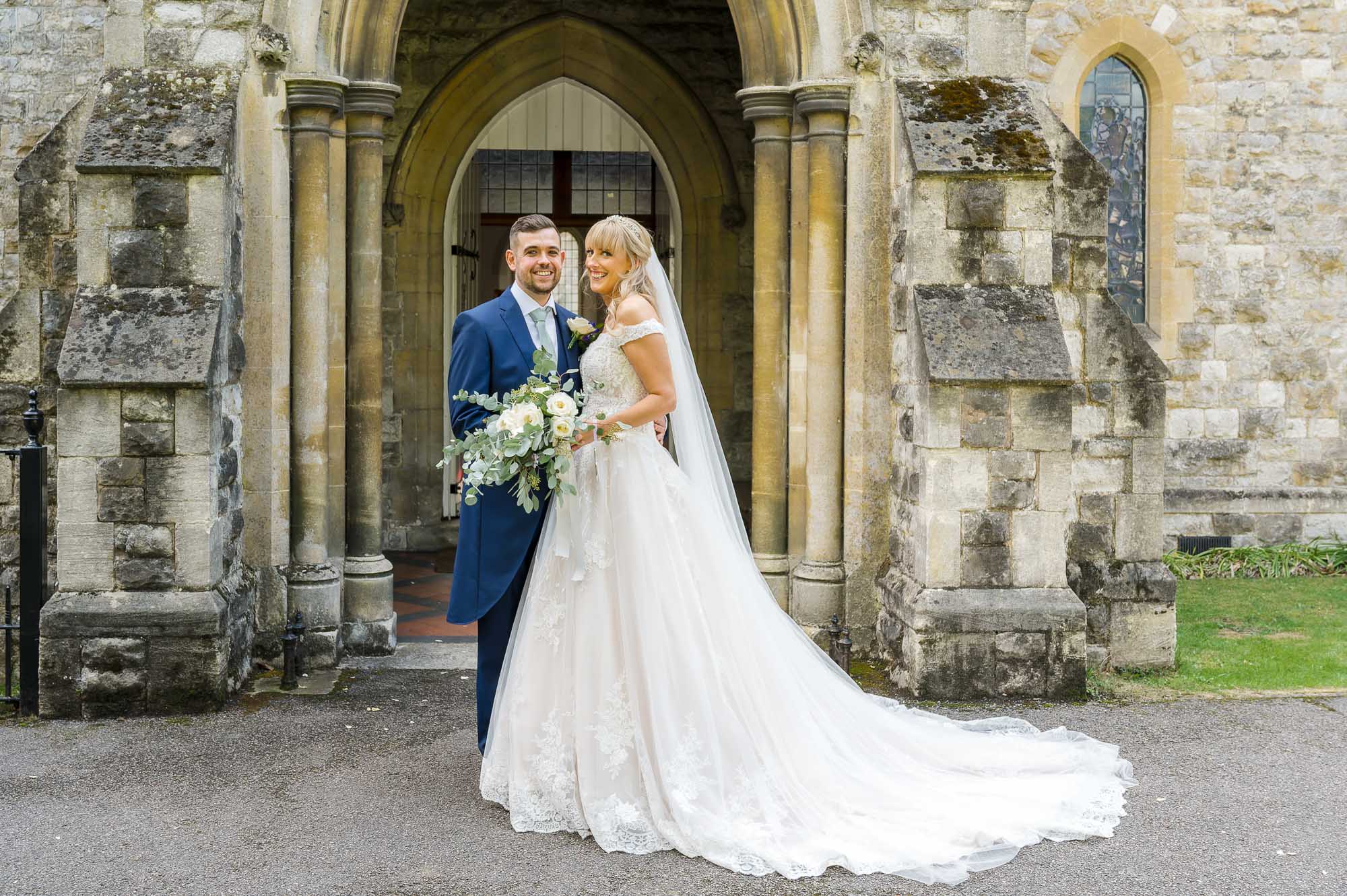 Bride and groom portrait in front of St John the Evangelist Church, Bexley, Kent