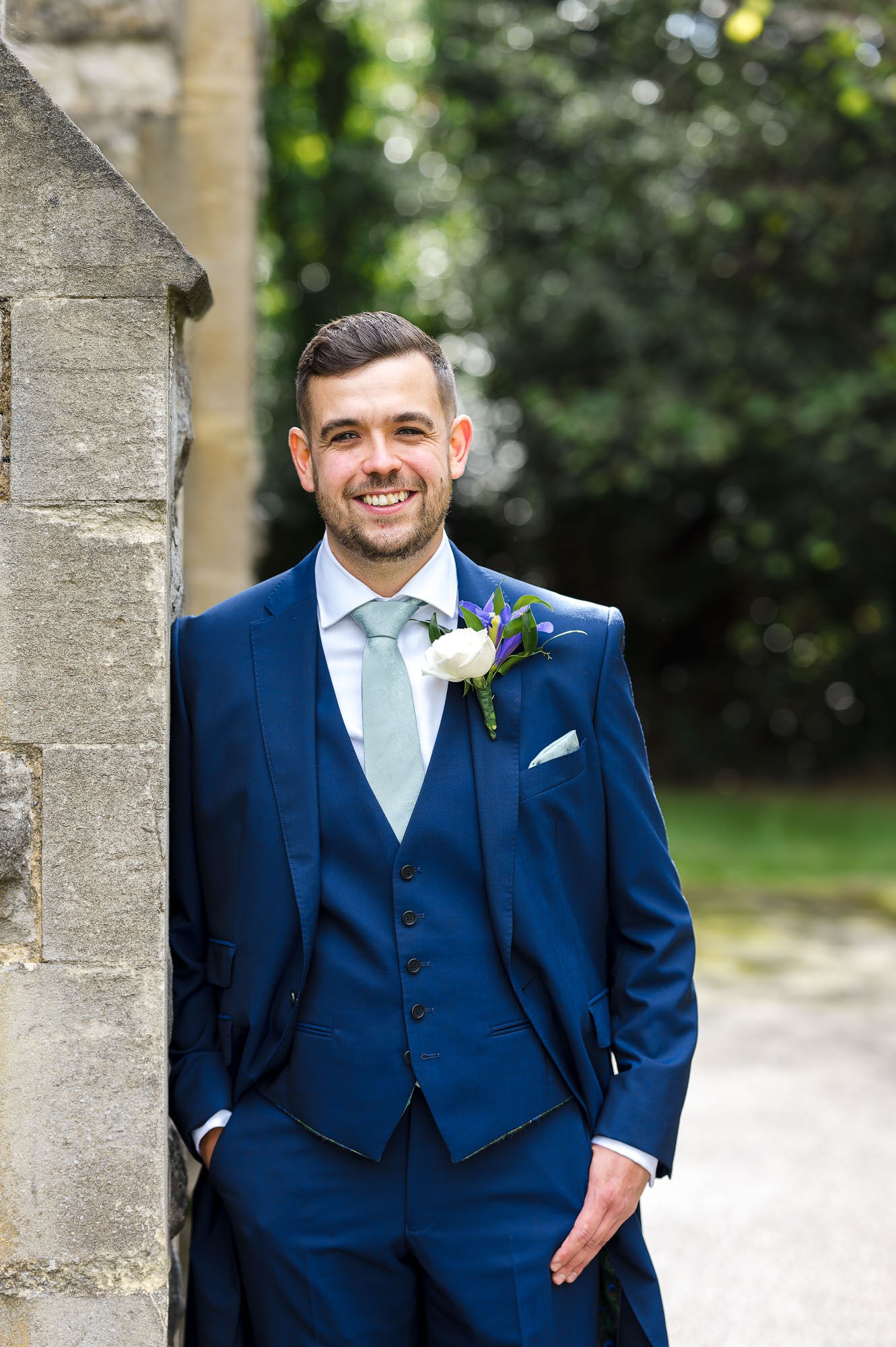 Groom portrait outside St John the Evangelist Church, Bexley, Kent