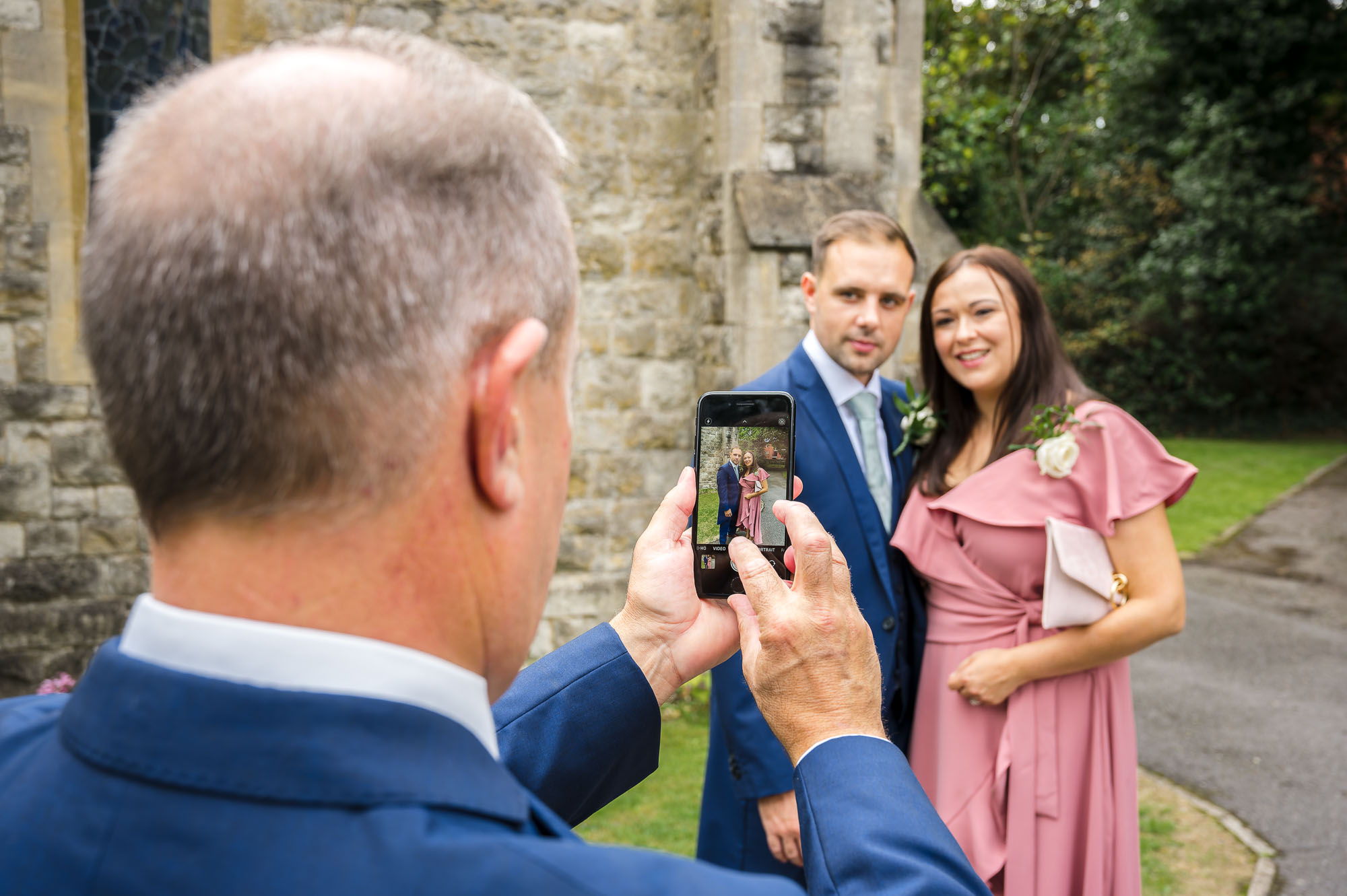 Guests being photographed at the Bexley wedding at St John the Evangelist Church.