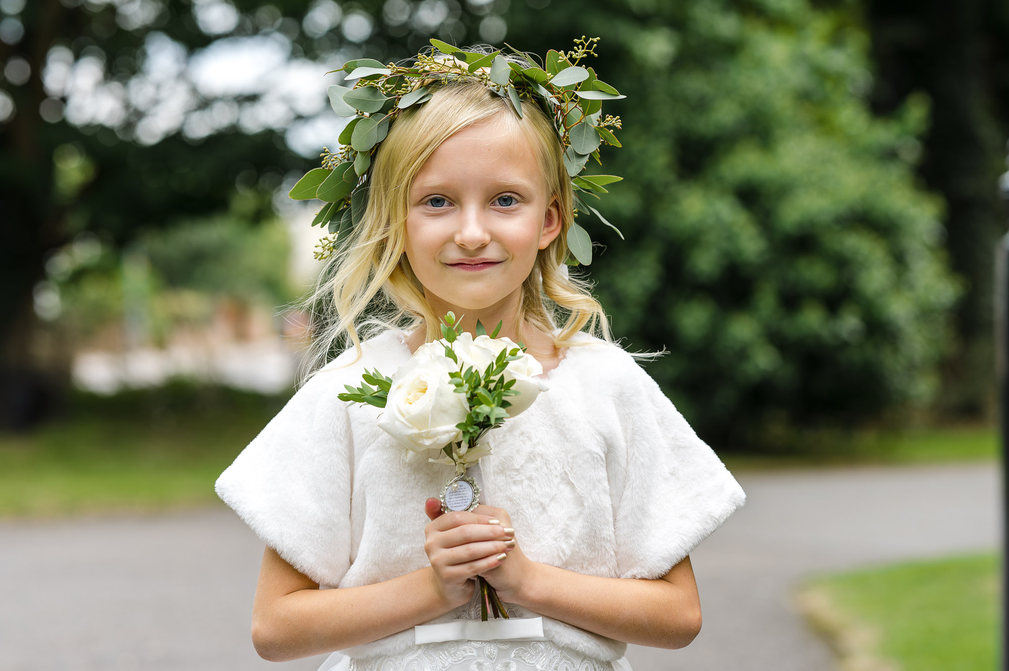 Portrait of flower girl outside St John the Evangelist Church, Bexley, Kent